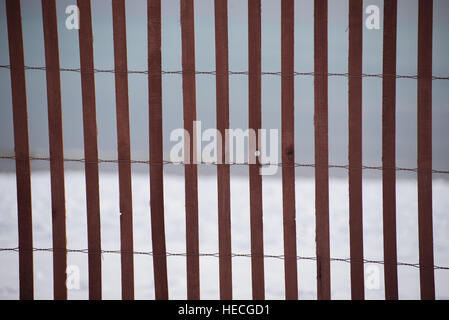 Fence on a lake Stock Photo