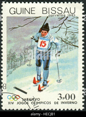 A stamp printed in Guinea-Bissau, dedicated to Winter Olympic Games - Sarajevo 84, shows the Biathlon Stock Photo