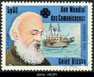 A stamp printed in Guinea-Bissau, shows a Scots-Irish mathematical physicist and engineer William Thomson, 1st Baron Kelvin Stock Photo