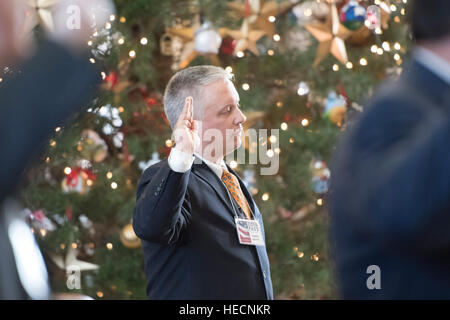 Austin, Texas, USA. 19th Dec, 2016. Rogue elector Chris Suprun takes the Oath of Office as Texas electors to the U.S. Electoral College meet at the Texas Capitol to cast votes for President Donald Trump and Vice-President Mike Pence.  Hundreds of protesters chanted outside the Capitol during the vote. Credit: Bob Daemmrich/Alamy Live News Stock Photo