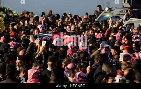 Karak, Jordan. 19th Dec, 2016. The funeral of Lieutenant Colonel Saed Mayateh is held in Karak City, Jordan, Dec. 19, 2016. Four gunmen killed Saed Mayateh and nine other people, including a Canadian tourist, in a series of attacks Sunday night in south Jordan's Karak Governorate. © Mohammad Abu Ghosh/Xinhua/Alamy Live News Stock Photo