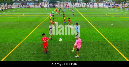 Haikou, Haikou, China. 13th Dec, 2016. Haikou, CHINA-December 13 2016: (EDITORIAL USE ONLY. CHINA OUT) .Students playing football in Lingshan Middle School in Haikou, south China's Hainan Province, December 13th, 2016. © SIPA Asia/ZUMA Wire/Alamy Live News Stock Photo