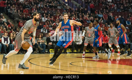 Chicago, USA.  19 December 2016. Bulls forward (#44), Nikola Mirotic, in possession, watched by Pistons forward (#30), Jon Leuer, during the Chicago Bulls vs Detroit Pistons game at the United Center in Chicago. Final score - Detroit Pistons 82, Chicago Bulls 113.  © Stephen Chung / Alamy Live News Stock Photo
