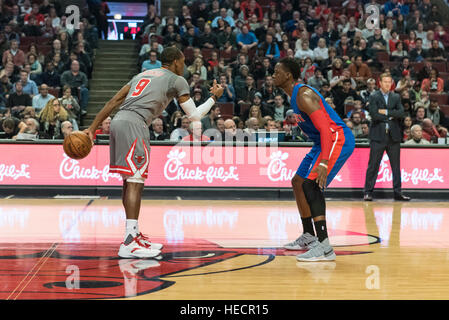 Chicago, USA.  19 December 2016. Bulls guard (#9), Rajon Rondo, in possession watched by Pistons guard (#1), Reggie Jackson, during the Chicago Bulls vs Detroit Pistons game at the United Center in Chicago. Final score - Detroit Pistons 82, Chicago Bulls 113.  © Stephen Chung / Alamy Live News Stock Photo