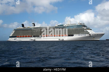 The Celebrity Reflection, which carries 3,609 passengers and 1271 crew, in the harbor of George Town, Grand Cayman in the Cayman Islands on Tuesday, December 20, 2016.  The smaller boats are tenders to ferry passengers back and forth to the island.  The Celebrity Reflection is the newest ship in the Celebrity fleet which is a brand of Royal Caribbean International.   Credit: Ron Sachs / CNP /MediaPunch Stock Photo