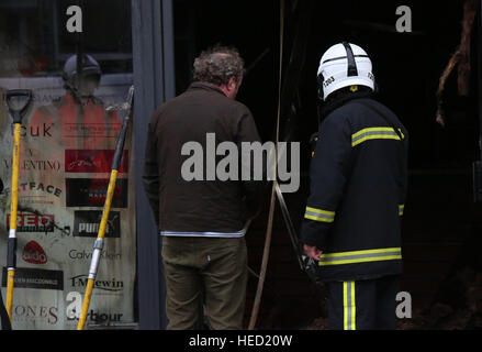 Southsea, Hampshire, UK. 21 December 2016. Fifty Firefighters have been called to tackle a Southsea dry cleaners this morning Ten appliances were called to the Impress launderette in Albert Road just before 6am this morning, Crews from Cosham, Southsea, Fareham, Waterlooville, Portchester and Havant have attended the incident near the Bold Forester Pub. An aerial ladder from St Mary's was brought in to tackle the blaze from above. The blaze took hold of the Impress dry cleaners, next door to the Bold Forester pub in Albert Road, at approximately 6am this morning. Credit: uknip/Alamy Live News Stock Photo