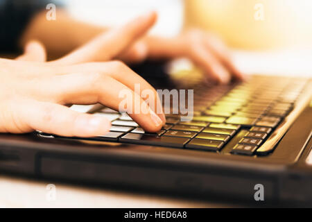 Hands on Laptop Keyboard. Hacker in Action Concept. Stock Photo