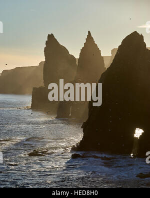 Thirle Door and the Stacks of Duncansby, Caithness, Scotland.  Silhouetted on a winters afternoon. Stock Photo