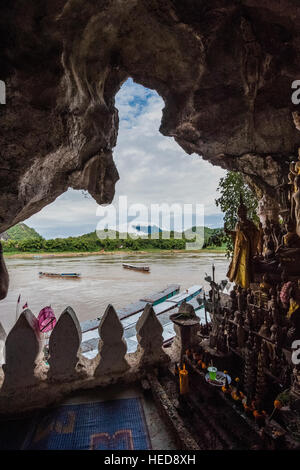 Tourist boats at the Pak Ou, Tham Ting Buddhist sanctuary and caves on the Mekong River Stock Photo
