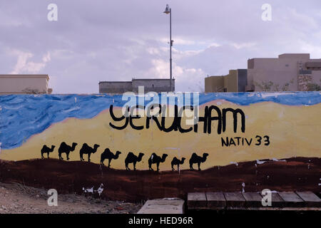 A painted wall depicting a convoy of camels in Yeruham town in the Negev desert southern Israel. Stock Photo