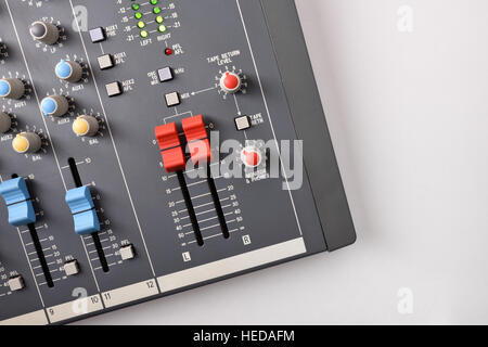 Buttons close up sound mixer on white table. Top view. Horizontal composition Stock Photo