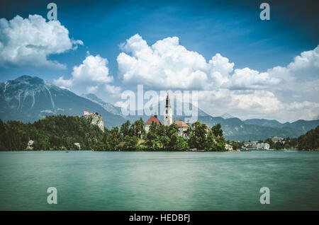 Summer scene in the park of Bled lake with St Mary's church and medieval castle Blejski grad, Slovenia, Europe Stock Photo