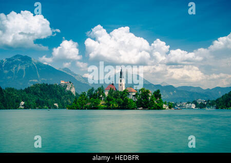 Summer scene in the park of Bled lake with St Mary's church and medieval castle Blejski grad, Slovenia, Europe Stock Photo