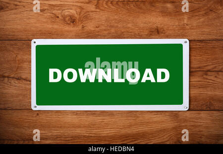 plaque with the inscription download on the wooden wall Stock Photo