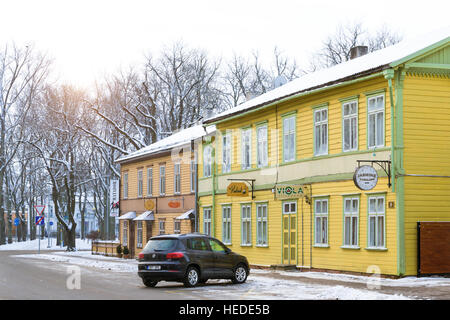 Parnu, Estonia - January 10, 2016: Architectural diversity in centre of resort Estonian town Parnu. Historic wooden buildings and attractions. Snow Stock Photo