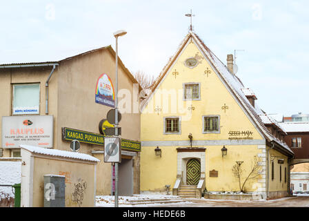 Parnu, Estonia - January 10, 2016: Architectural diversity in centre of resort Estonian town Parnu. Yellow stoned old hotel Seeg Stock Photo