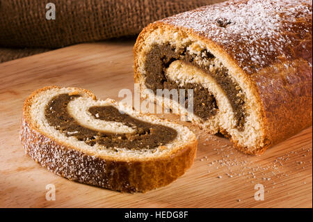 Traditional Hungarian folk cake xmas walnut rolls on a wooden cutting board Stock Photo