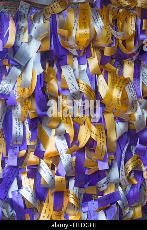 Ribbons with messages written on on display at Winchester Christmas Market, Winchester, Hampshire, England UK in December Stock Photo