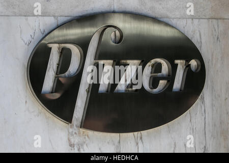 Pfizer sign on the exterior wall of their headquarters in Manhattan. Stock Photo