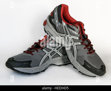 A pair of brand new Asics running shoes isolated on white. Stock Photo