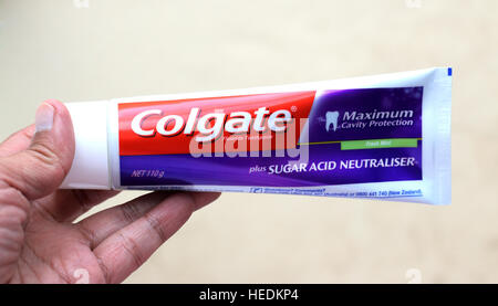 Hand holding Colgate Toothpaste Maximum cavity Protection -  isolated Stock Photo