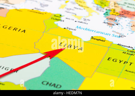Red arrow pointing Libya on the map of Africa continent Stock Photo