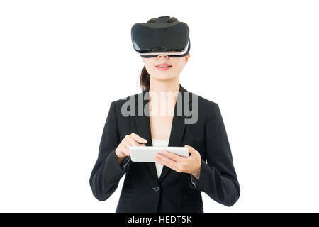 asian business woman use digital tablet to control virtual reality. VR headset glasses device. white isolated background Stock Photo