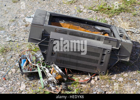 broken tv set on ground Stock Photo