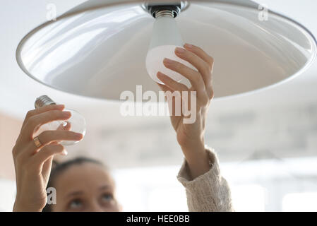 Power save LED lamp changing Stock Photo