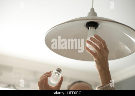 Power save LED lamp changing Stock Photo
