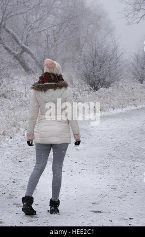 Woman in a winter park Stock Photo