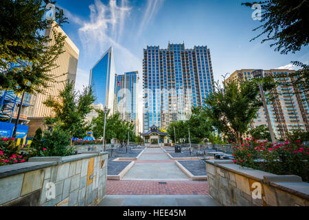 Walkway and modern buildings seen at Romare Bearden Park, in Uptown Charlotte, North Carolina. Stock Photo