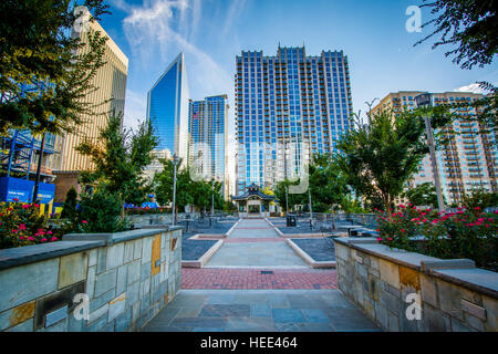 Walkway and modern buildings seen at Romare Bearden Park, in Uptown Charlotte, North Carolina. Stock Photo