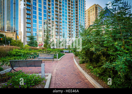 Walkway and modern buildings seen at Romare Bearden Park, in Uptown Charlotte, North Carolina. Stock Photo