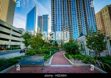 Walkway and modern buildings seen at Romare Bearden Park, in Uptown Charlotte, North Carolina. Stock Photo