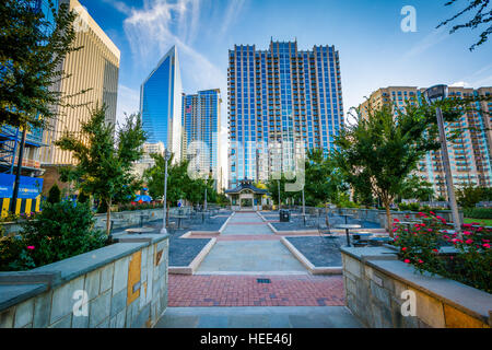 Walkway and modern buildings seen at Romare Bearden Park, in Uptown Charlotte, North Carolina. Stock Photo