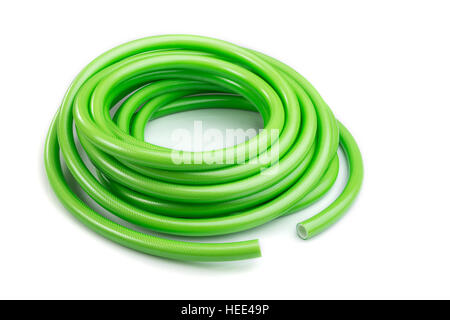 Close up green garden water hose isolated on white background Stock Photo