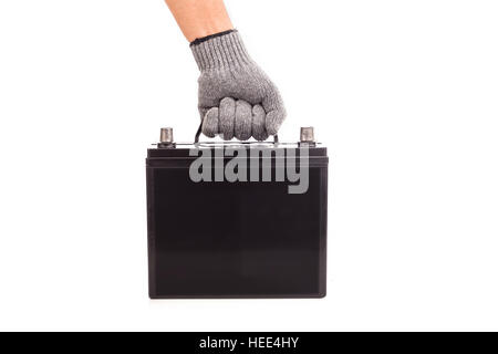 Close up hand holding black car battery isolated on white background Stock Photo
