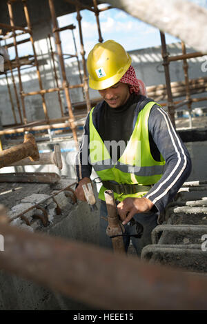 Workers construct the As-Samra waste water treatment plant in Zarqa, Jordan. Stock Photo