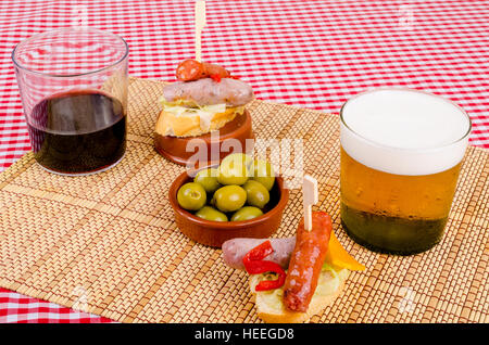 Pincho style chorizo tapa served with a drink Stock Photo - Alamy
