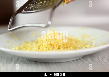 Grating lemon rind. Making Filo Pastry Topped Apple Pie Series. Stock Photo