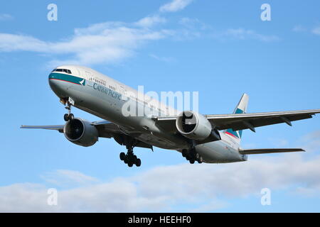 Cathay Pacific Boeing 777-300(ER) B-KQM landing at London Heathrow Airport, UK Stock Photo