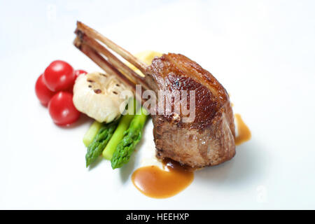 Lamb chop dish on a white plate Stock Photo
