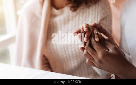 Cute young African American couple sitting in the cafe Stock Photo