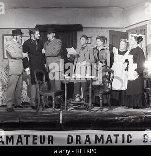 1965, historical, amateur dramatics, group of amateur theatre actors on stage performing a play, England, UK. Stock Photo