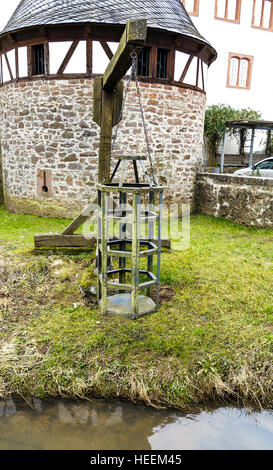 Witches cage - Medieval torture instrument at the river in Steinau an der Strasse, in Old Town close to birthplace Brothers Grim Stock Photo