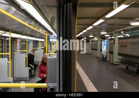 Passengers in subway train (U-Bahn) at metro train station in Berlin, Germany. Stock Photo