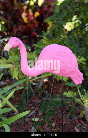 Pink plastic flamingo decorates a public garden in Orlando, Florida, USA. Stock Photo