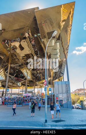 The historic Els Encants Flea Market in Barcelona, Spain with a permanent building and a gleaming mirrored roof 25 meters above. Stock Photo