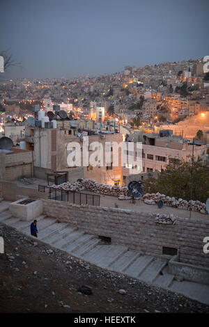 Nighttime street scene in Amman, Jordan showing the ancient Roman amphitheater. Stock Photo